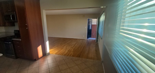 corridor featuring tile patterned flooring