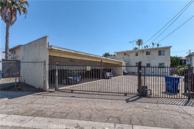 view of gate featuring a fenced front yard