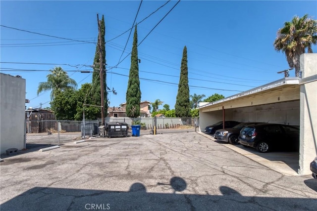 covered parking lot with fence