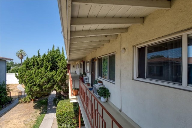 view of home's exterior featuring fence and stucco siding