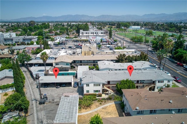 birds eye view of property with a mountain view