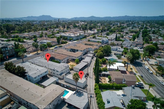 drone / aerial view featuring a residential view and a mountain view