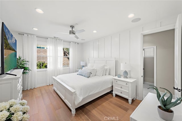 bedroom with light wood-type flooring, ceiling fan, and recessed lighting