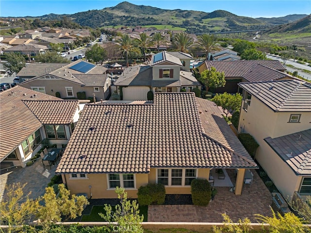 drone / aerial view with a residential view and a mountain view