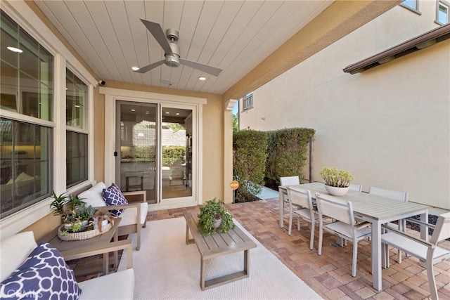 view of patio featuring visible vents, outdoor dining space, and a ceiling fan