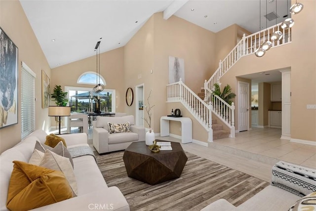 living area with high vaulted ceiling, wood finished floors, baseboards, stairs, and beam ceiling