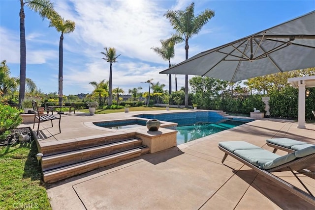 pool featuring a patio area and a hot tub