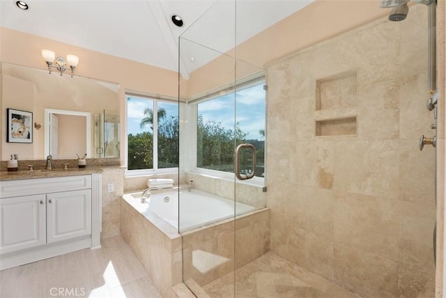 full bath with a bath, lofted ceiling, tiled shower, and vanity