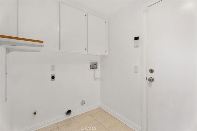 laundry area featuring laundry area, hookup for a gas dryer, hookup for an electric dryer, washer hookup, and light tile patterned flooring