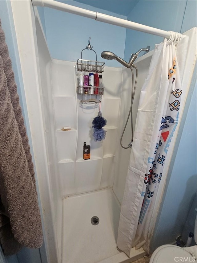 bathroom featuring a stall shower