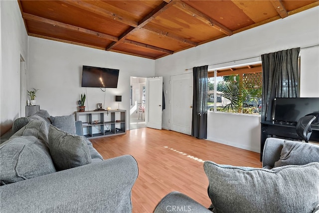 living room featuring beam ceiling, wood ceiling, wood finished floors, coffered ceiling, and baseboards