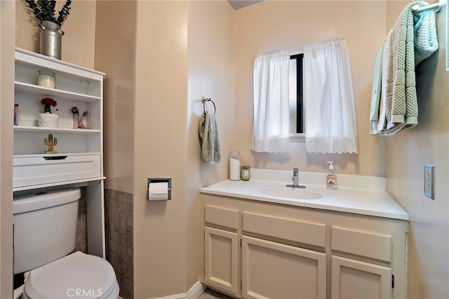 bathroom with vanity and toilet