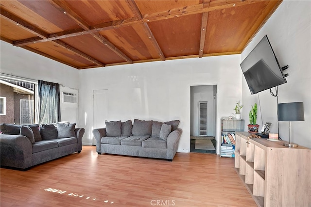 living room featuring wood ceiling, beamed ceiling, an AC wall unit, and light wood finished floors