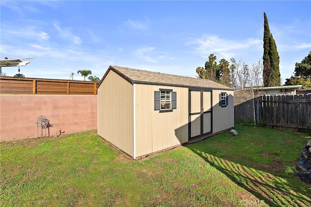 view of shed featuring a fenced backyard