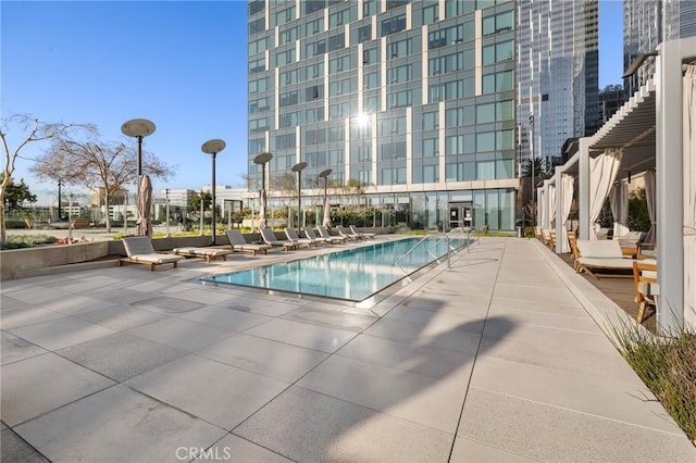 community pool with a patio area