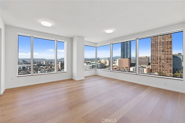 unfurnished sunroom with a view of city