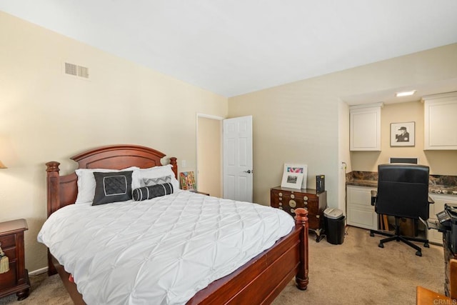 bedroom with light colored carpet and visible vents