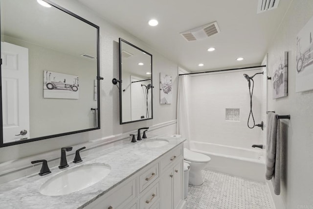 full bathroom with toilet, visible vents, and a sink