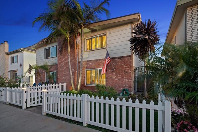 255 Daisy, Imperial Beach, CA 91932 - view of front facade with brick siding and a fenced front yard