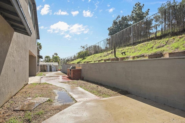 view of yard featuring a patio area and fence