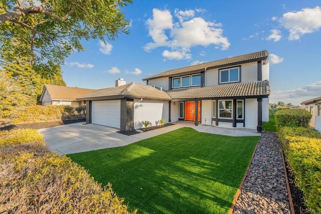 view of front of home featuring a tile roof, a chimney, a garage, driveway, and a front lawn