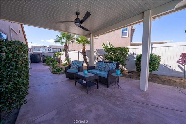 view of patio with an outdoor living space, a fenced backyard, and a ceiling fan