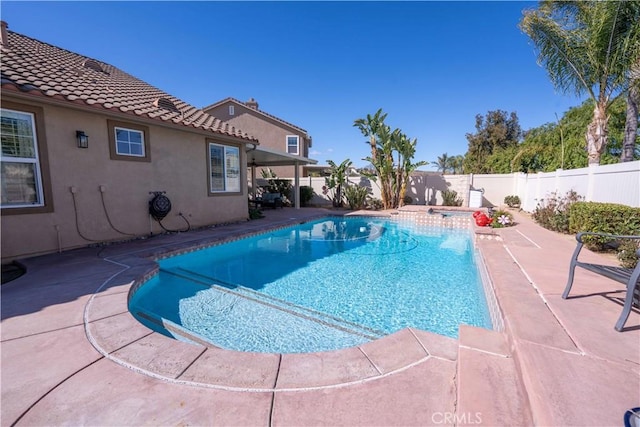 view of swimming pool featuring a patio area, a fenced backyard, and a fenced in pool