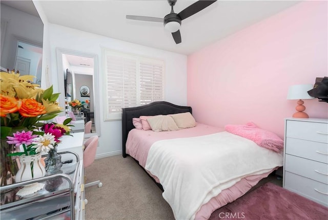 carpeted bedroom featuring a ceiling fan