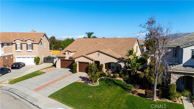 view of front of house with a garage, concrete driveway, a tiled roof, a residential view, and a front lawn