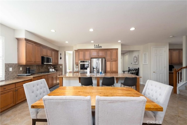 dining room with light tile patterned floors, stairway, and recessed lighting