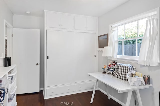 mudroom with dark wood finished floors