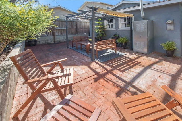 view of patio / terrace with fence and a pergola