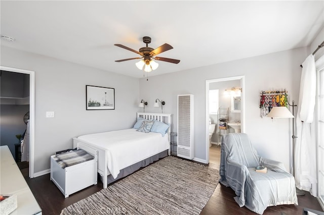 bedroom featuring ceiling fan, baseboards, wood finished floors, and ensuite bathroom