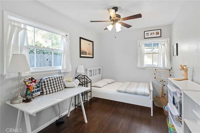 bedroom featuring dark wood-style floors and ceiling fan