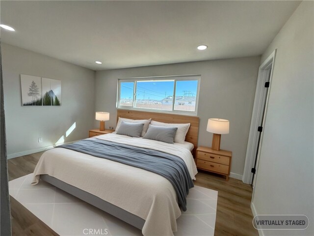 420 N Yorktown St, Ridgecrest, CA 93555 - bedroom with recessed lighting, baseboards, and wood finished floors