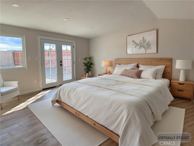 420 N Yorktown St, Ridgecrest, CA 93555 - bedroom with baseboards, french doors, wood finished floors, and access to exterior