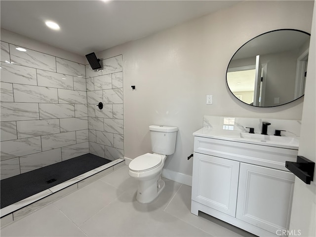420 N Yorktown St, Ridgecrest, CA 93555 - bathroom featuring baseboards, tiled shower, vanity, and toilet