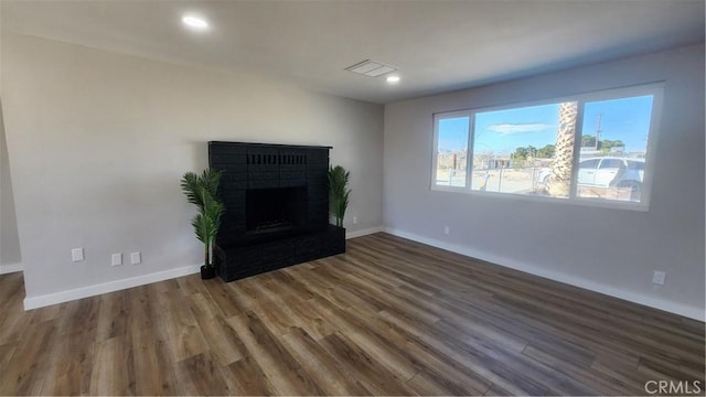 420 N Yorktown St, Ridgecrest, CA 93555 - unfurnished living room featuring recessed lighting, a fireplace, baseboards, and wood finished floors