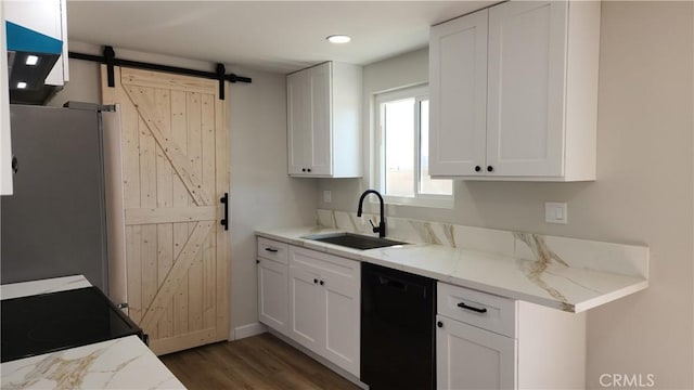 420 N Yorktown St, Ridgecrest, CA 93555 - kitchen with a barn door, a sink, white cabinets, light stone countertops, and black appliances