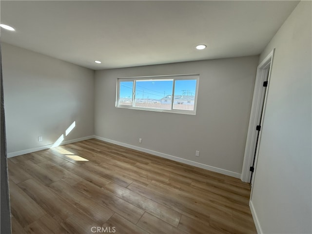 420 N Yorktown St, Ridgecrest, CA 93555 - empty room featuring baseboards, wood finished floors, and recessed lighting