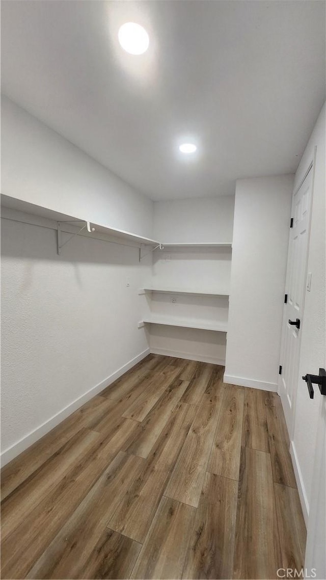 420 N Yorktown St, Ridgecrest, CA 93555 - spacious closet featuring wood finished floors