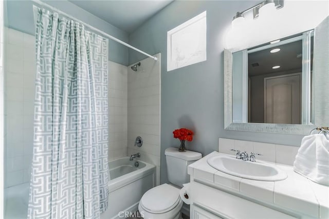 full bathroom with vanity, toilet, and shower / bathtub combination with curtain