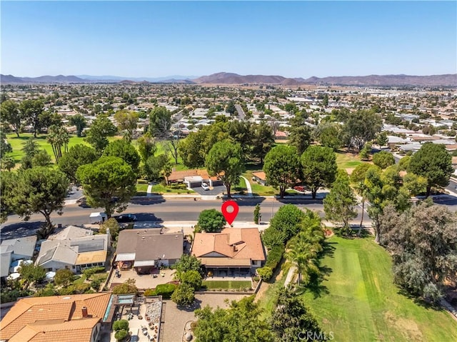 drone / aerial view featuring a residential view and a mountain view