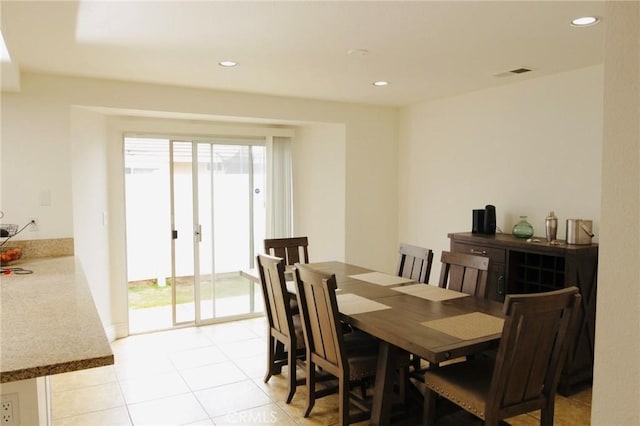 dining area with light tile patterned floors, plenty of natural light, visible vents, and recessed lighting