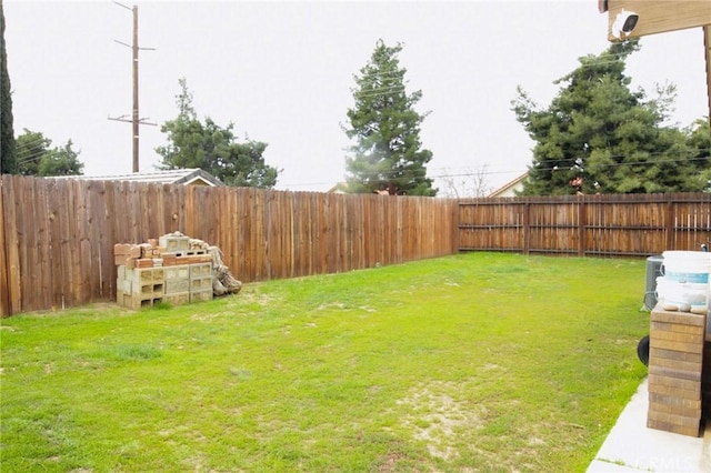 view of yard with a fenced backyard