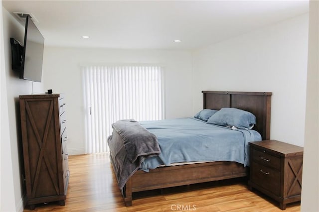 bedroom featuring light wood-style flooring and recessed lighting