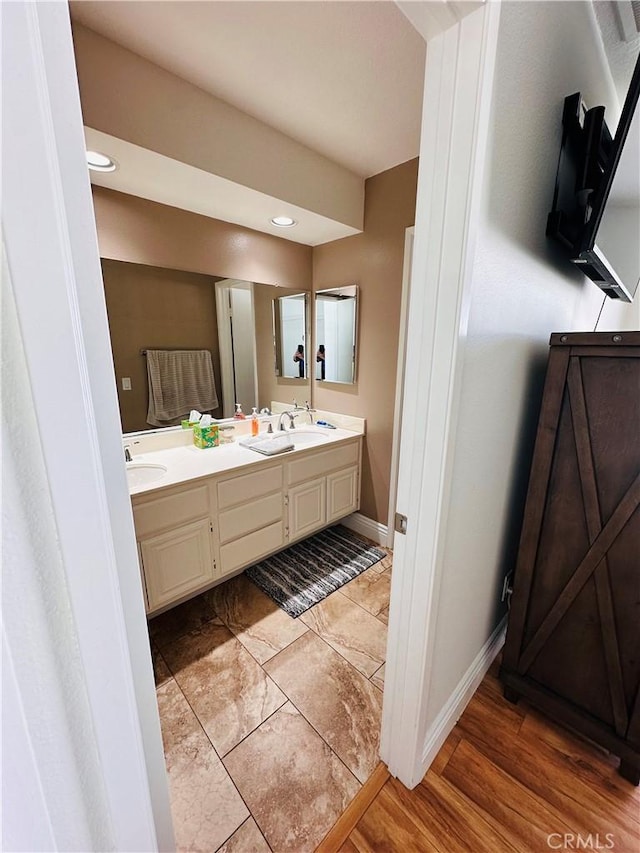 25501 Sand Creek Trl, Moreno Valley, CA 92557 - full bath featuring double vanity, baseboards, and a sink