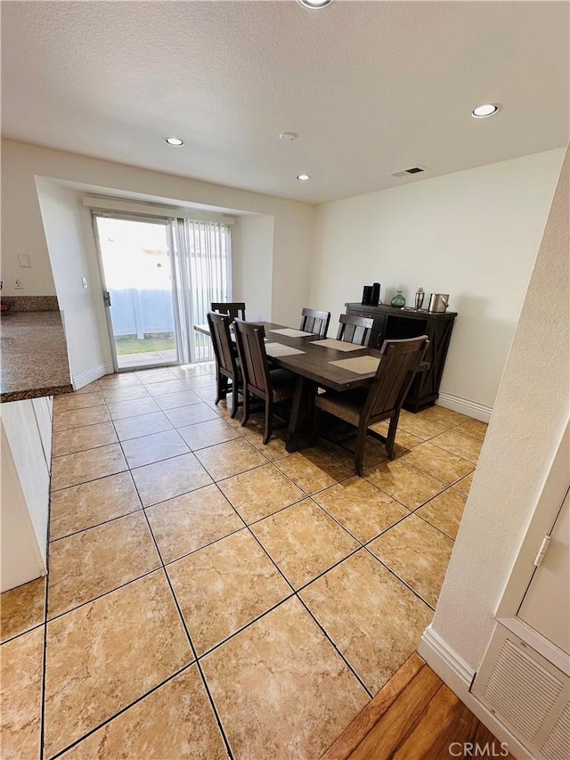 25501 Sand Creek Trl, Moreno Valley, CA 92557 - dining area with visible vents, a textured ceiling, recessed lighting, light tile patterned floors, and baseboards