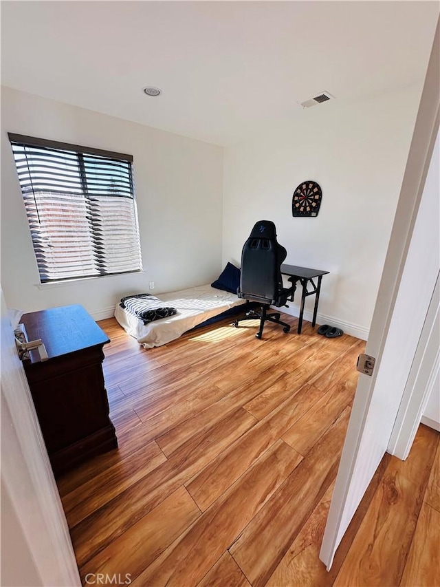 25501 Sand Creek Trl, Moreno Valley, CA 92557 - bedroom with wood finished floors, visible vents, and baseboards