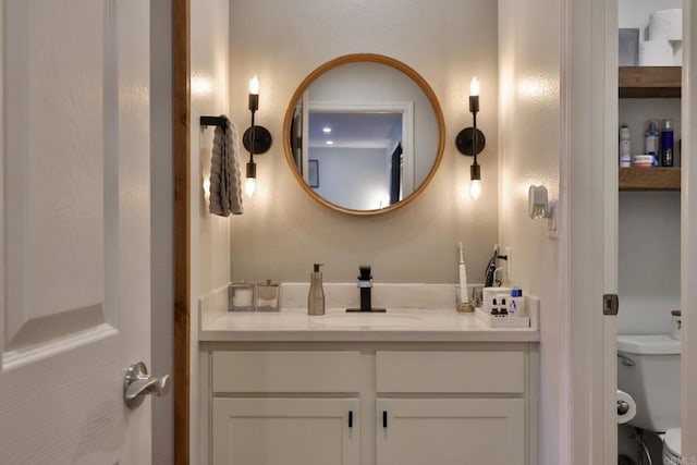 bathroom with vanity and toilet